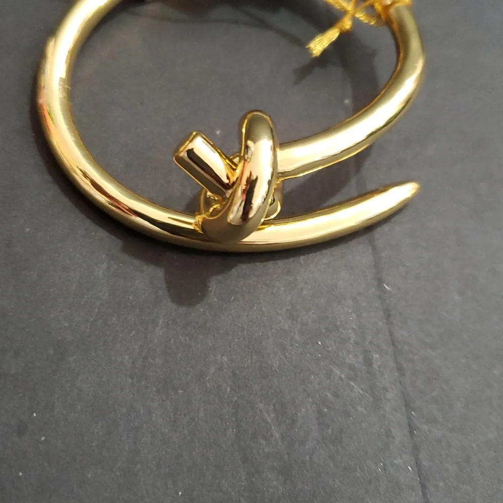 Eye Candy gold tone knot and point open‎ cuff hinged bracelet bangle brand new